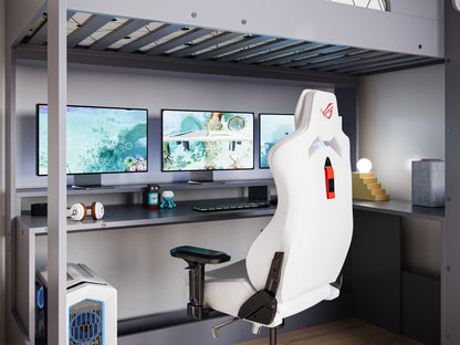 A sleek and modern gaming setup featuring a white racing-style chair, triple monitor display, a dedicated gaming PC, and ambient lighting, all within a compact and organized loft space with a Flair Furnishings Skyhigh Gaming High Sleeper Anthracite.